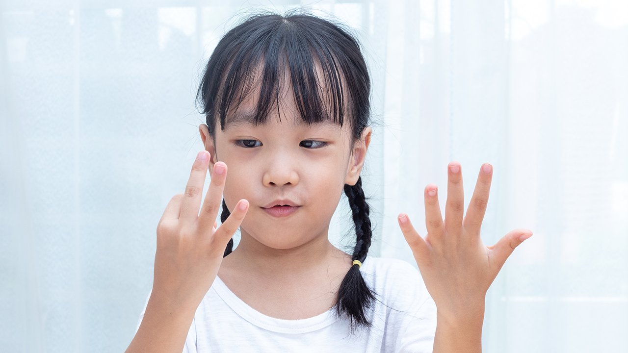 Girl counting with fingers